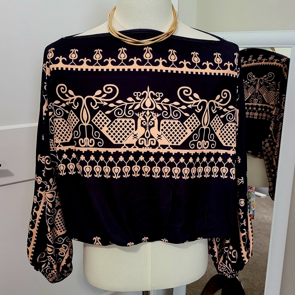 Chic Black and Cream Blouse with Elegant Design